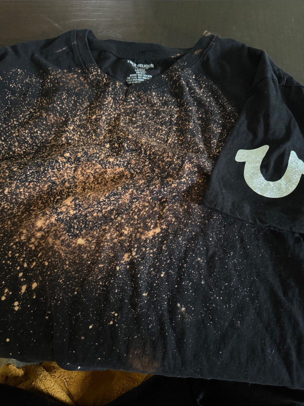 True Religion Black Tee with Bleach Splatter and Silver Sleeve Logo